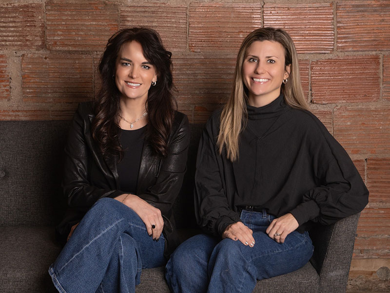 Women Sitting On Couch Women Sitting On Couch